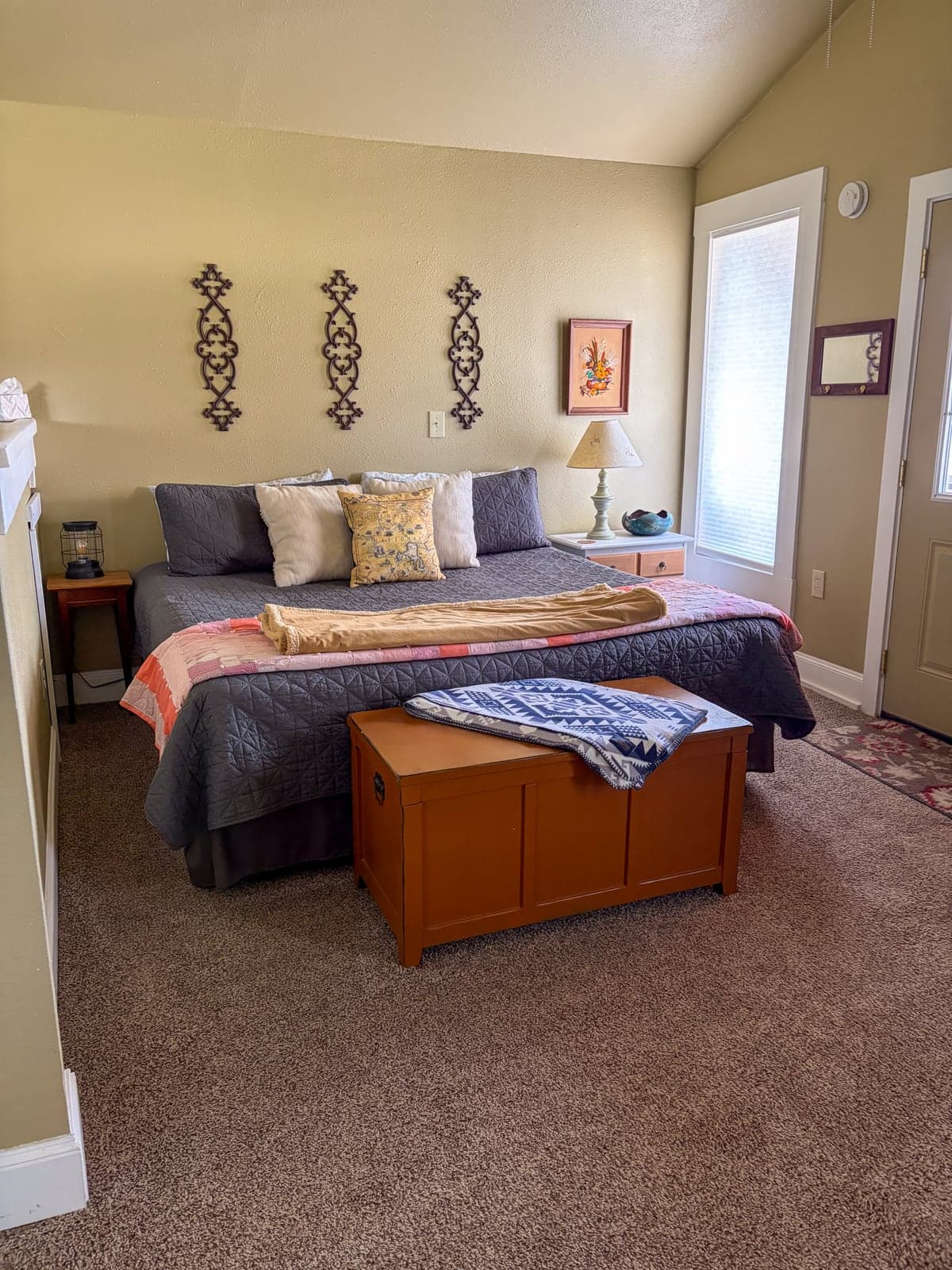 King bed at The Cottage with luxurious linens and natural light