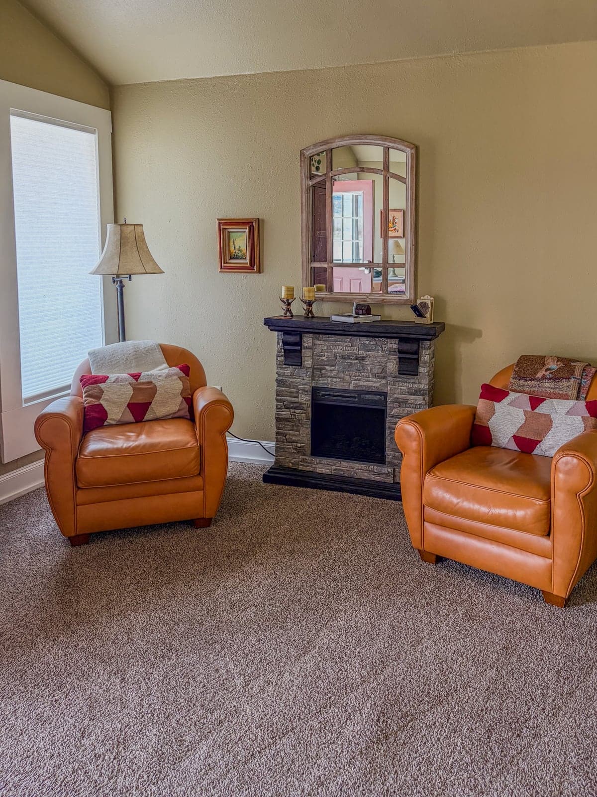 Mantel and seating detail inside The Cottage